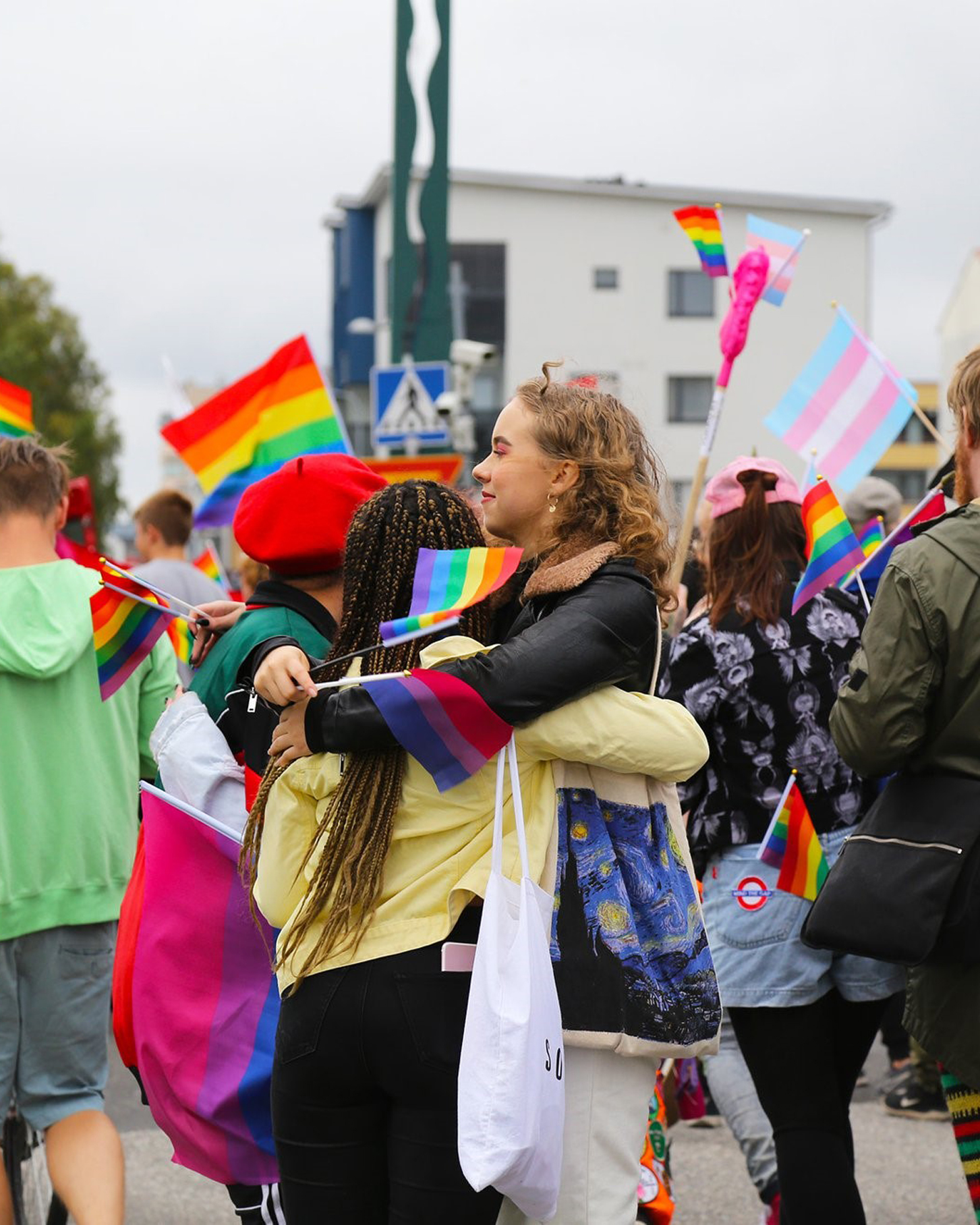 People at a Pride parade at the Swedish Finnish border.